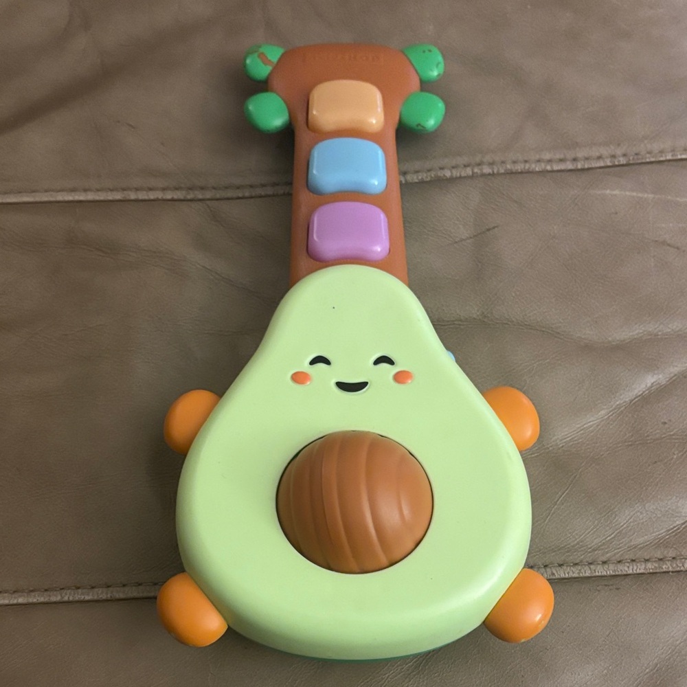 Skip Hop Avocado Toy Guitar with Green and Orange